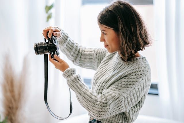 Person taking pictures with a camera