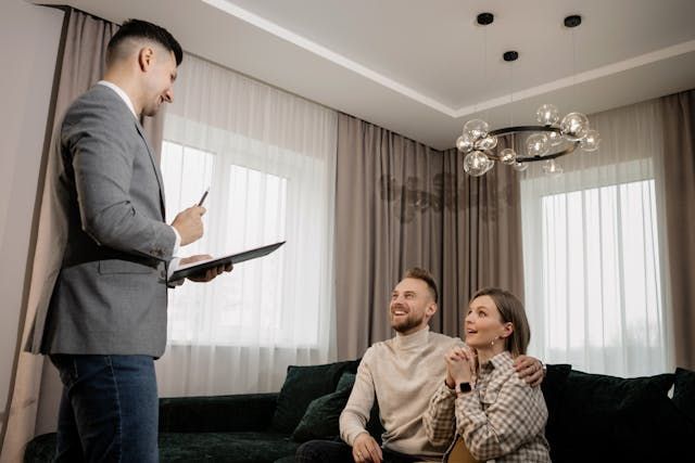 a landlord speaking with two prospective tenants