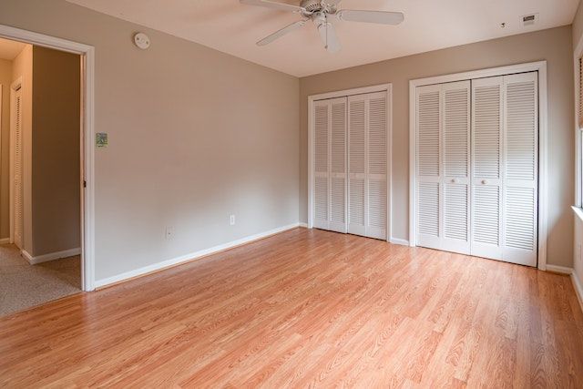 empty, unfurnished bedroom with hard wood flooring