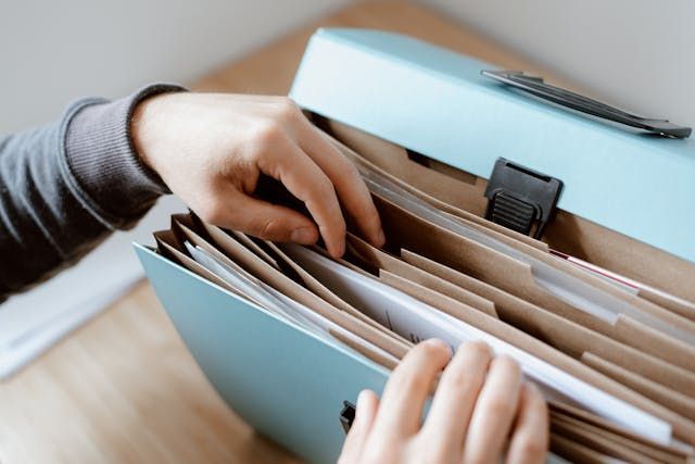 Person sorting through stored documents