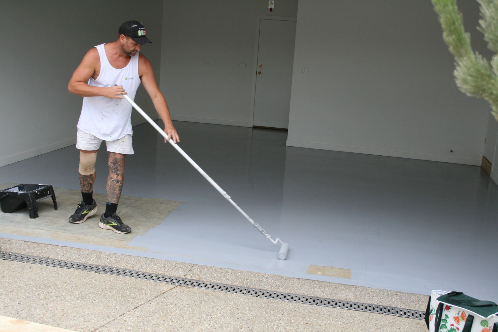 Man coating floor