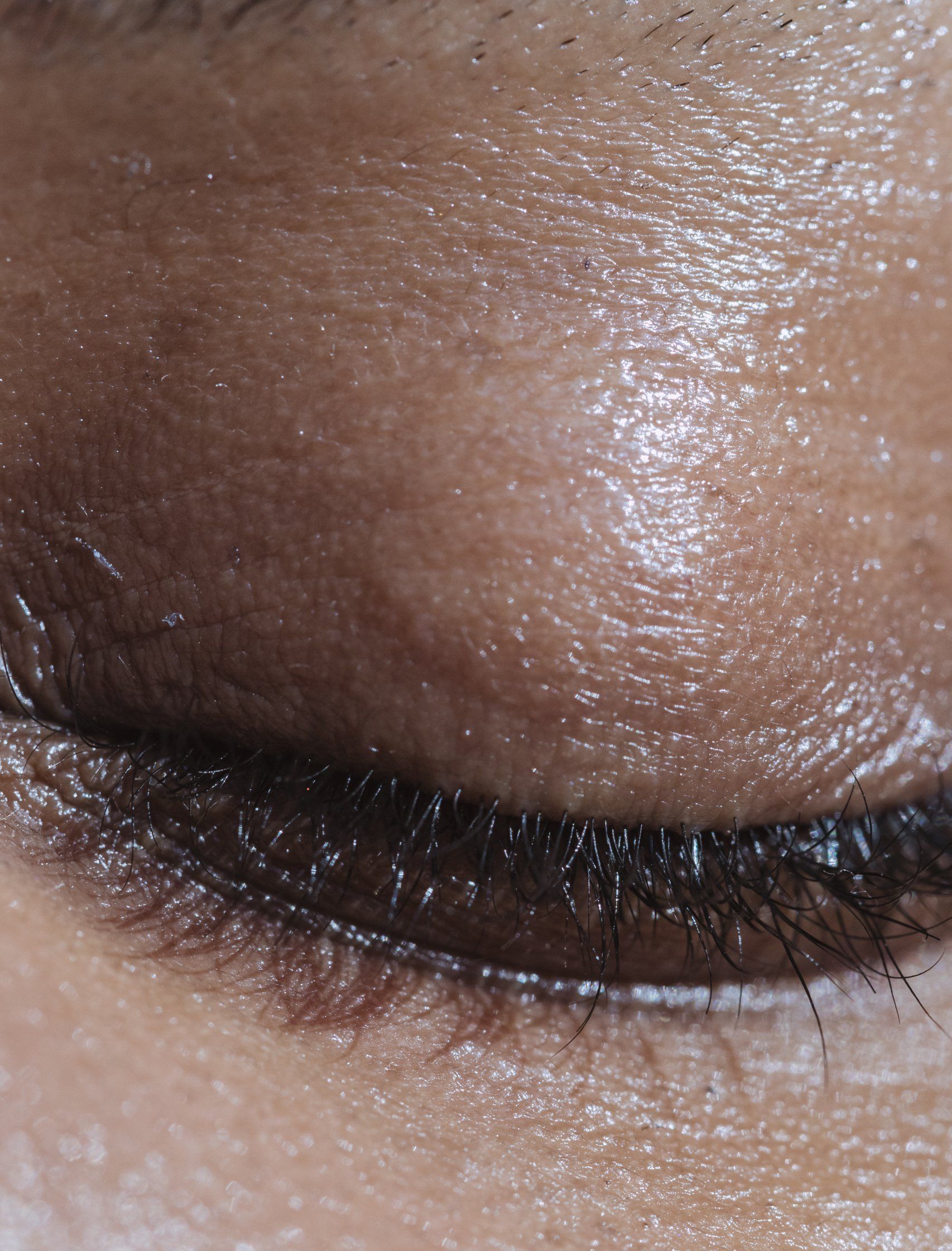 A close up of a woman 's eye with makeup on