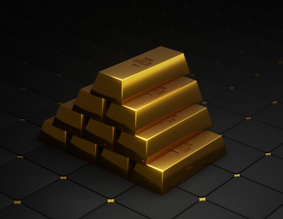 lingotti di oro a piramide su sfondo nero