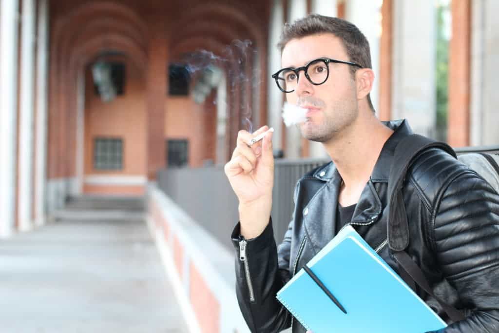 student smoking on campus