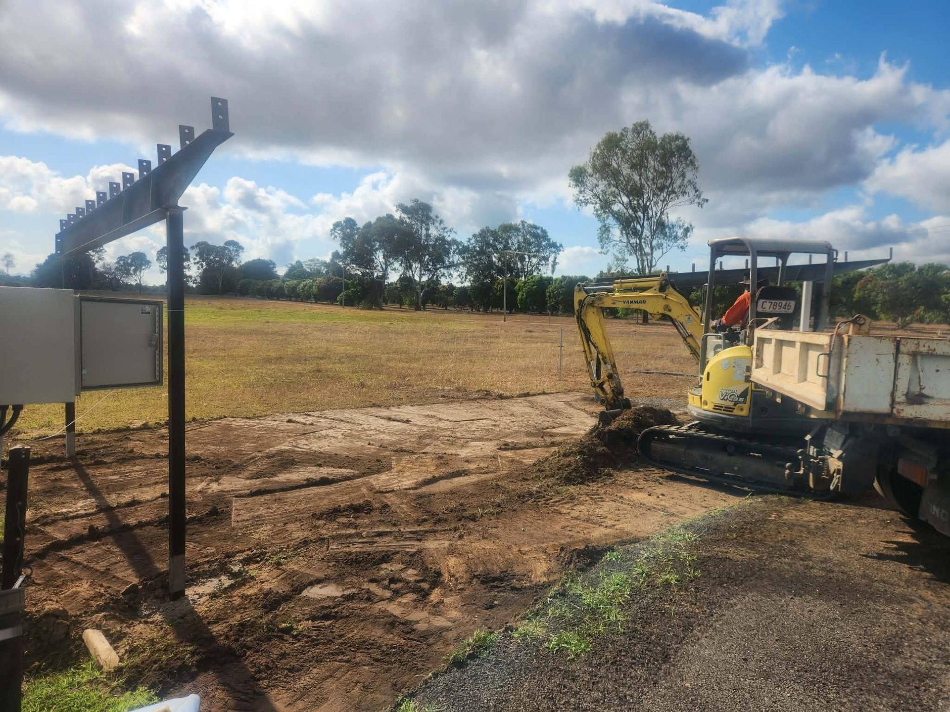 Yellow Front-end Loader Dumping Dirt — DJ Brazil Pty Ltd in Bowen, QLD