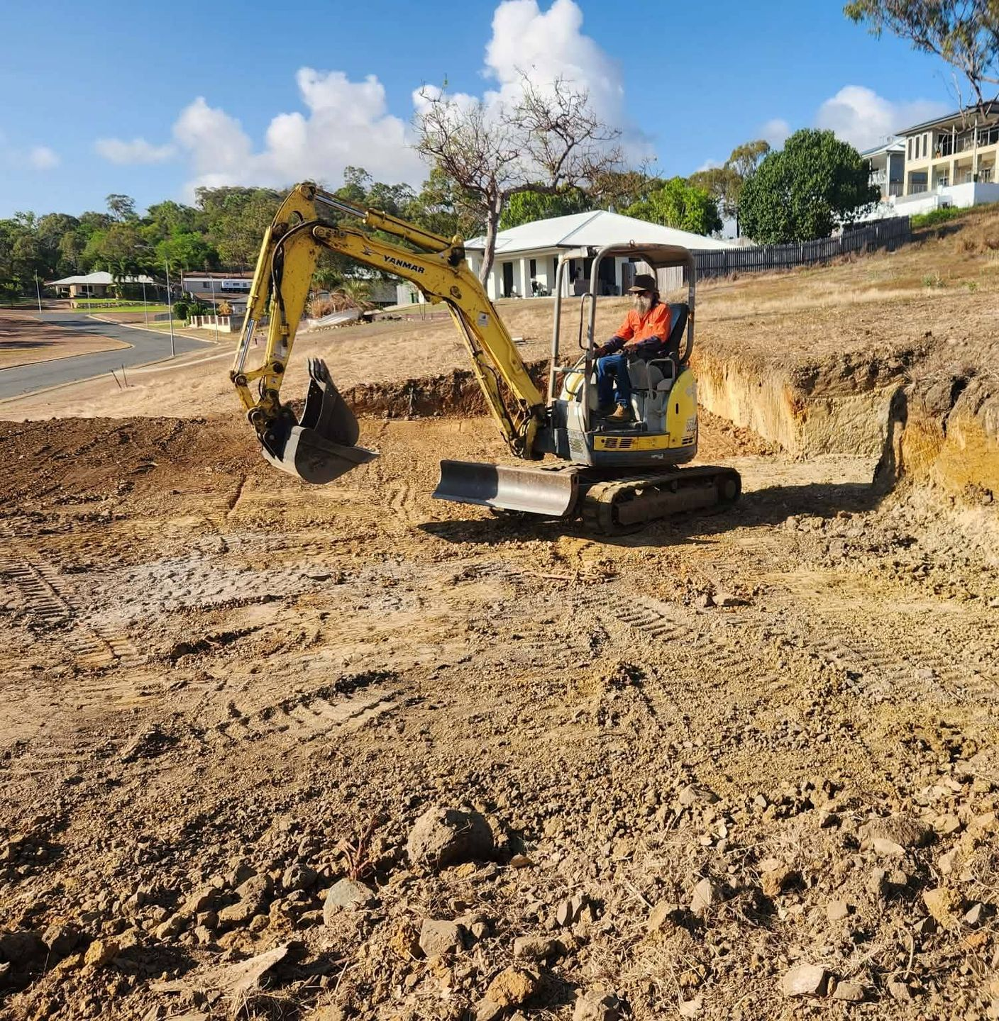 Yellow Excavator Clearing a Forest Area — DJ Brazil Pty Ltd in Bowen, QLD