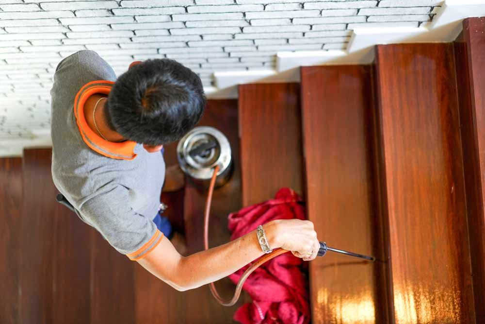Termite control service on wood stairs