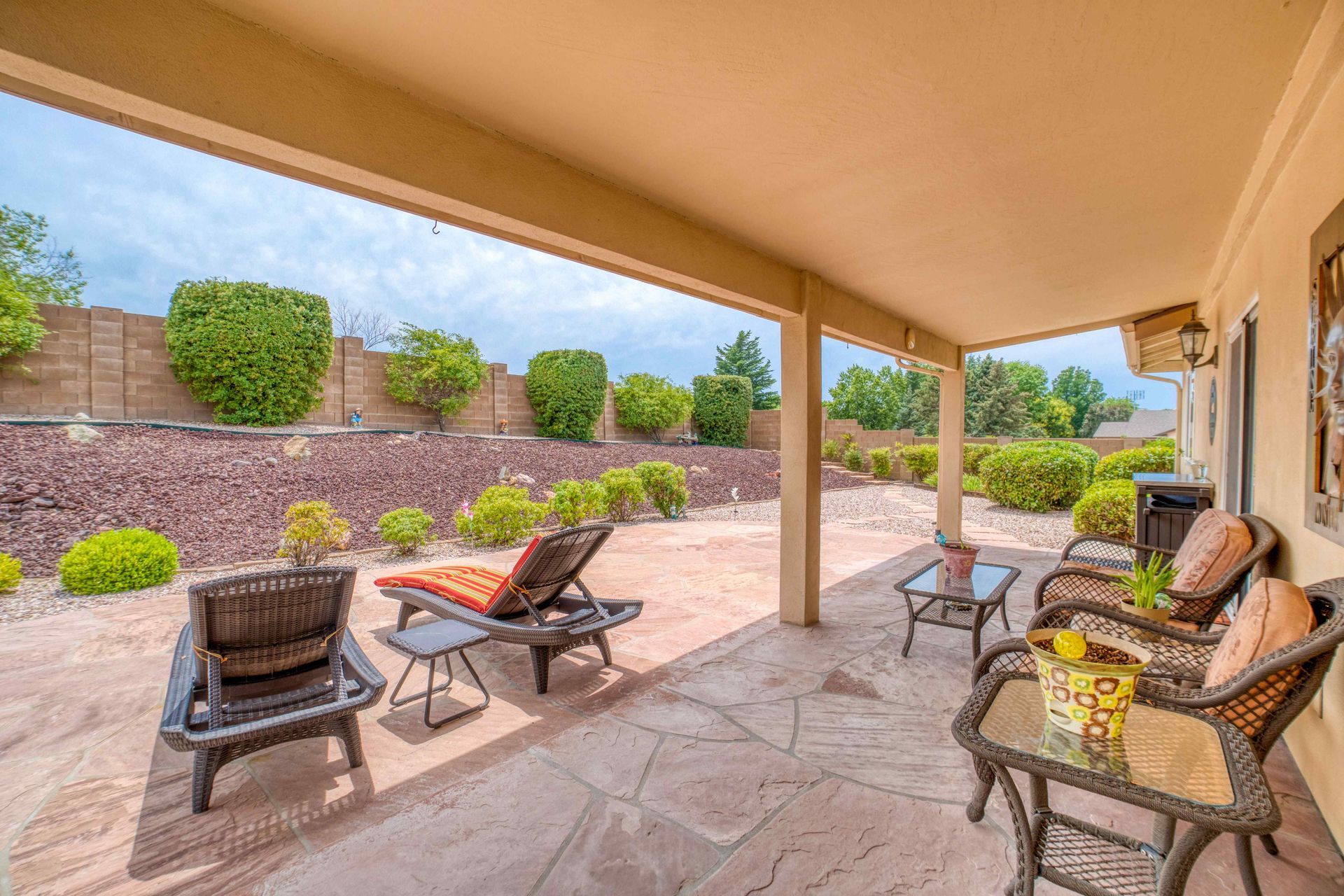 Outdoor living space with a fully landscaped yard by Affordable Landscapes Carson City