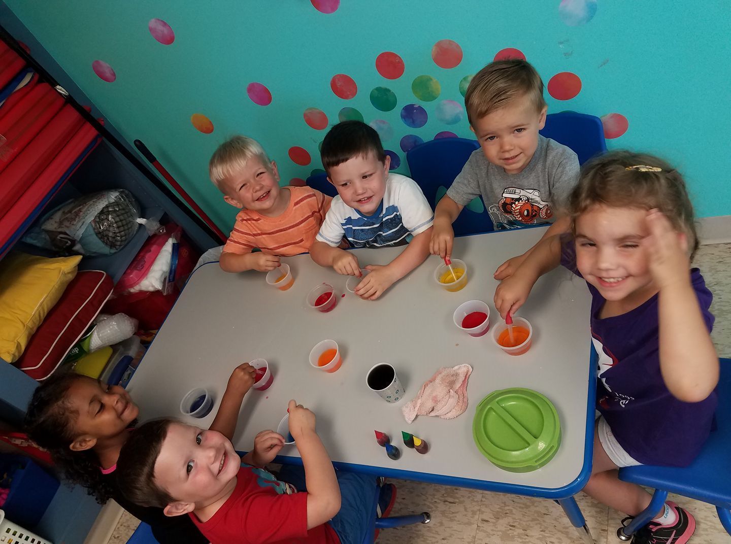 Daycare Center — Group Of Happy Kids Actively Playing In Bellevue, NE