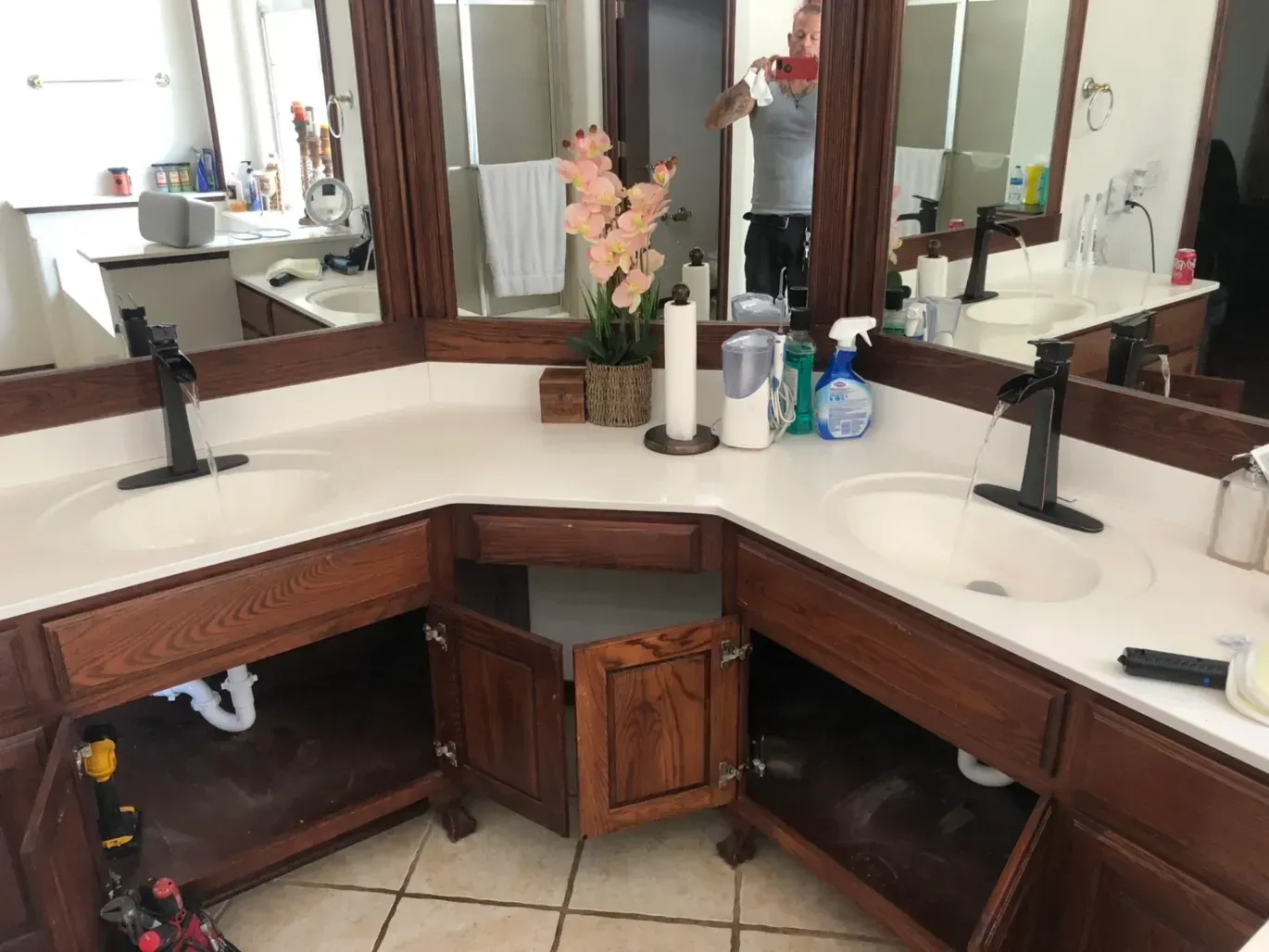 A bathroom with two sinks and two mirrors.