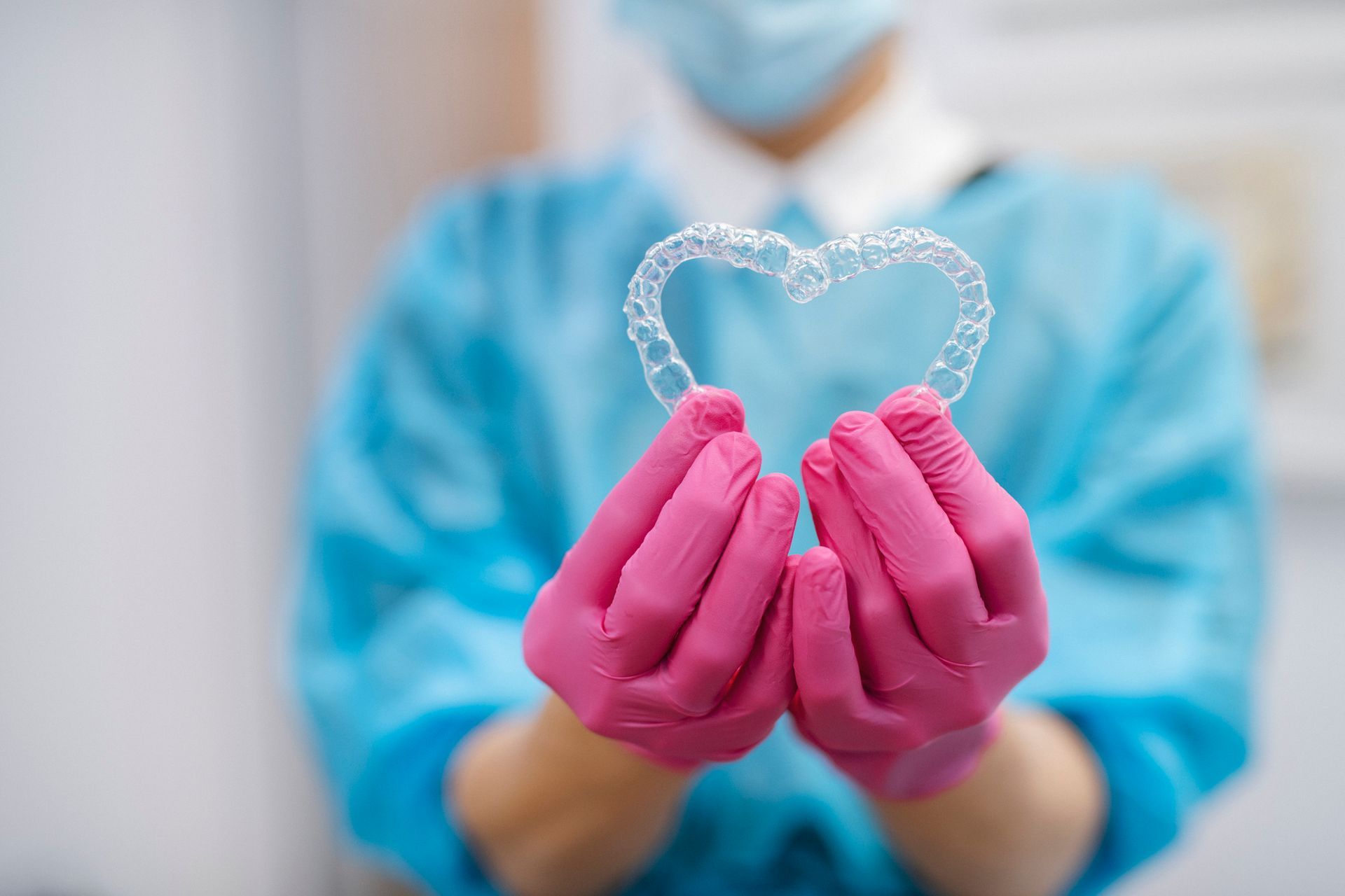 A close up of a woman 's mouth with braces on her teeth.