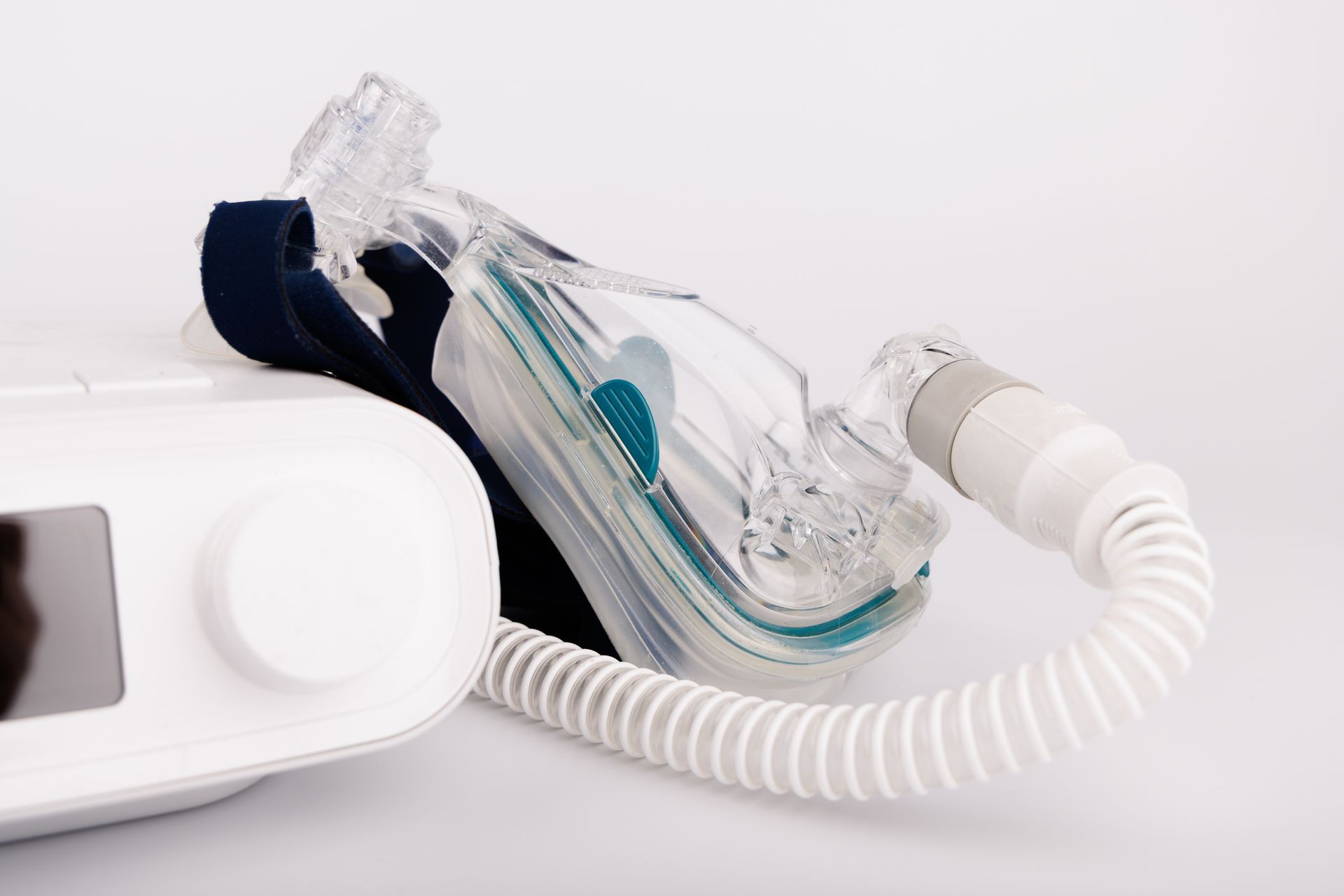 A close up of a cpap machine with a mask attached to it.