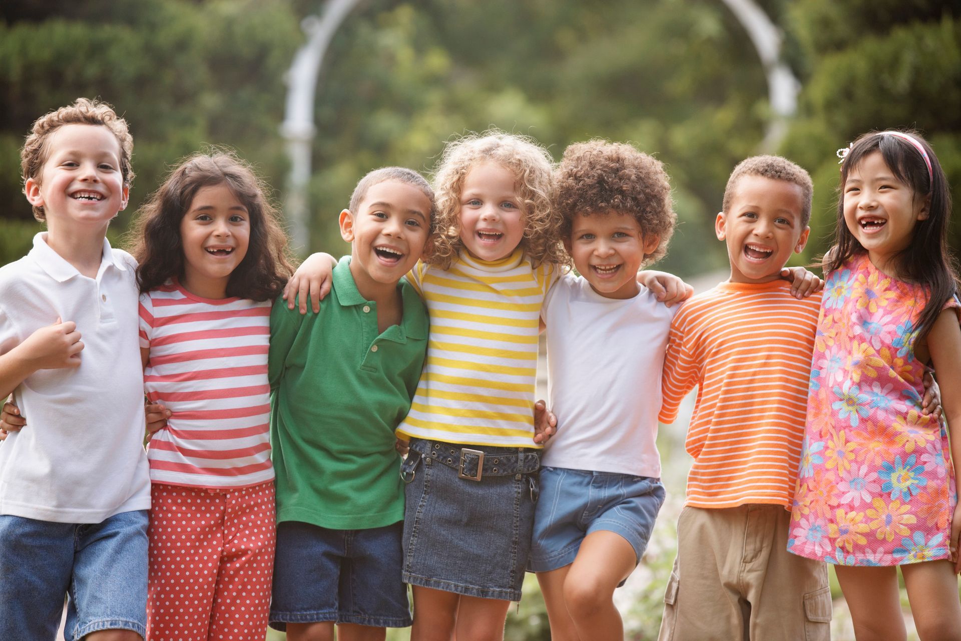 A group of children are posing for a picture together.