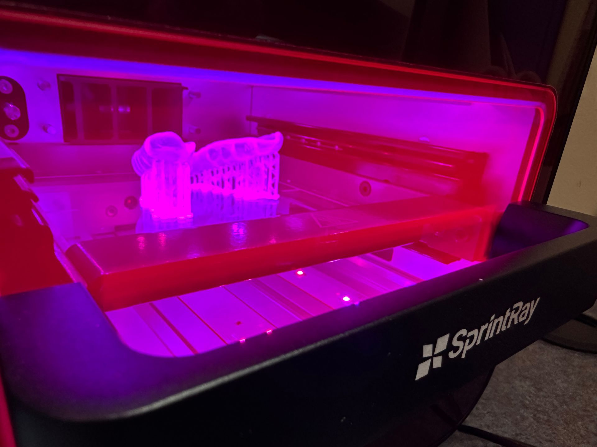 A laptop with a picture of teeth on the screen