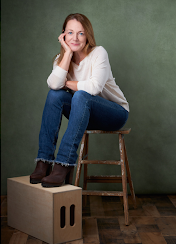 Woman sitting on wooden stool beside a cardboard box; poster titled “The Art of Positive Refusal” with white text on dark background