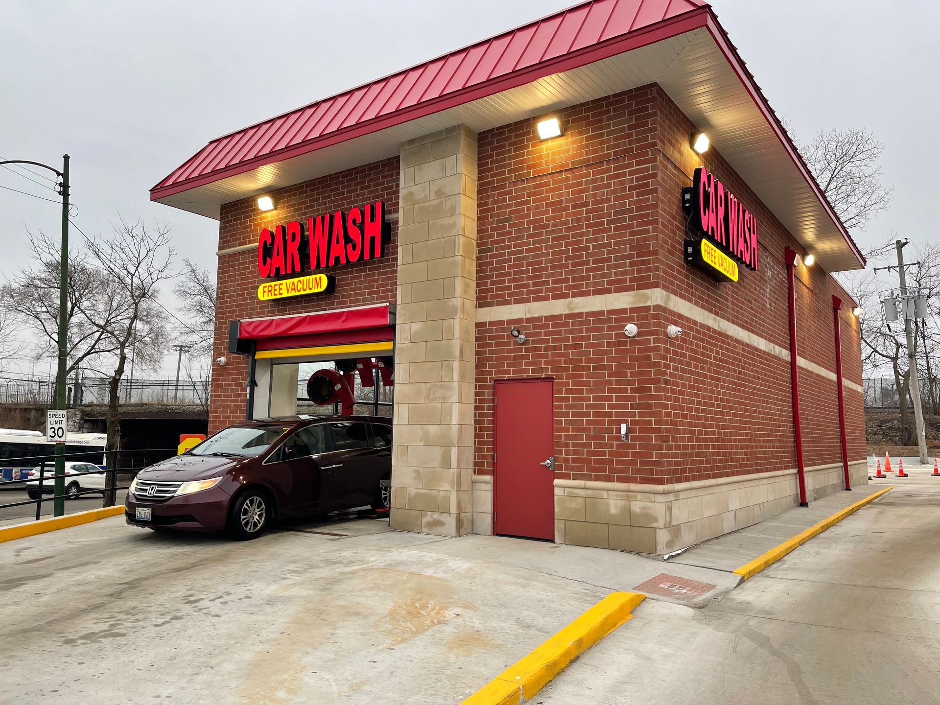 A car is parked in front of a car wash.