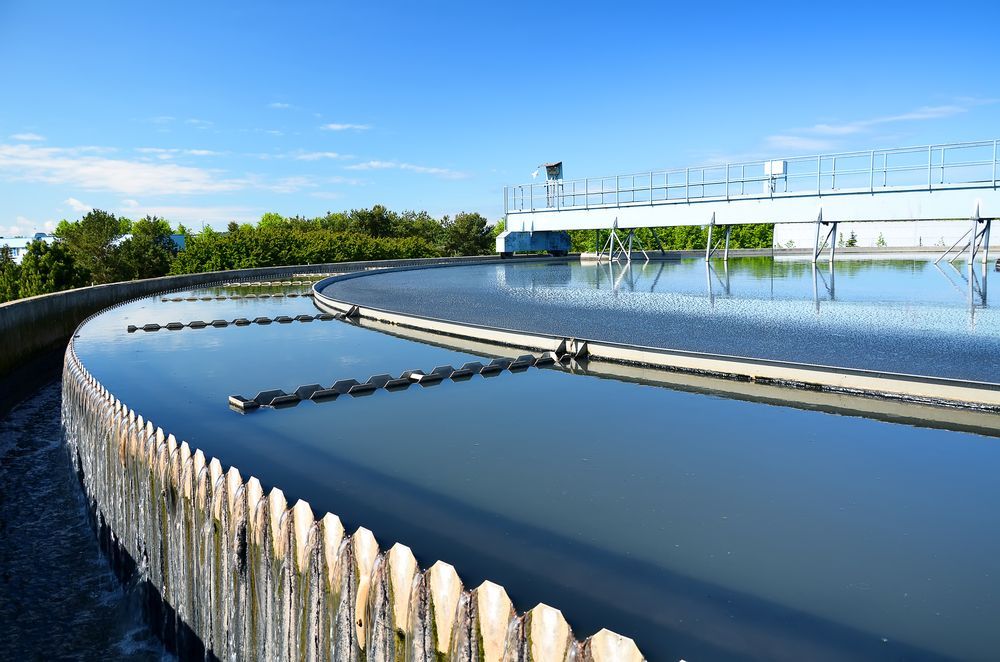 A Large Body Of Water With A Wooden Fence Around It — Christians Plumbing in Emerald, QLD