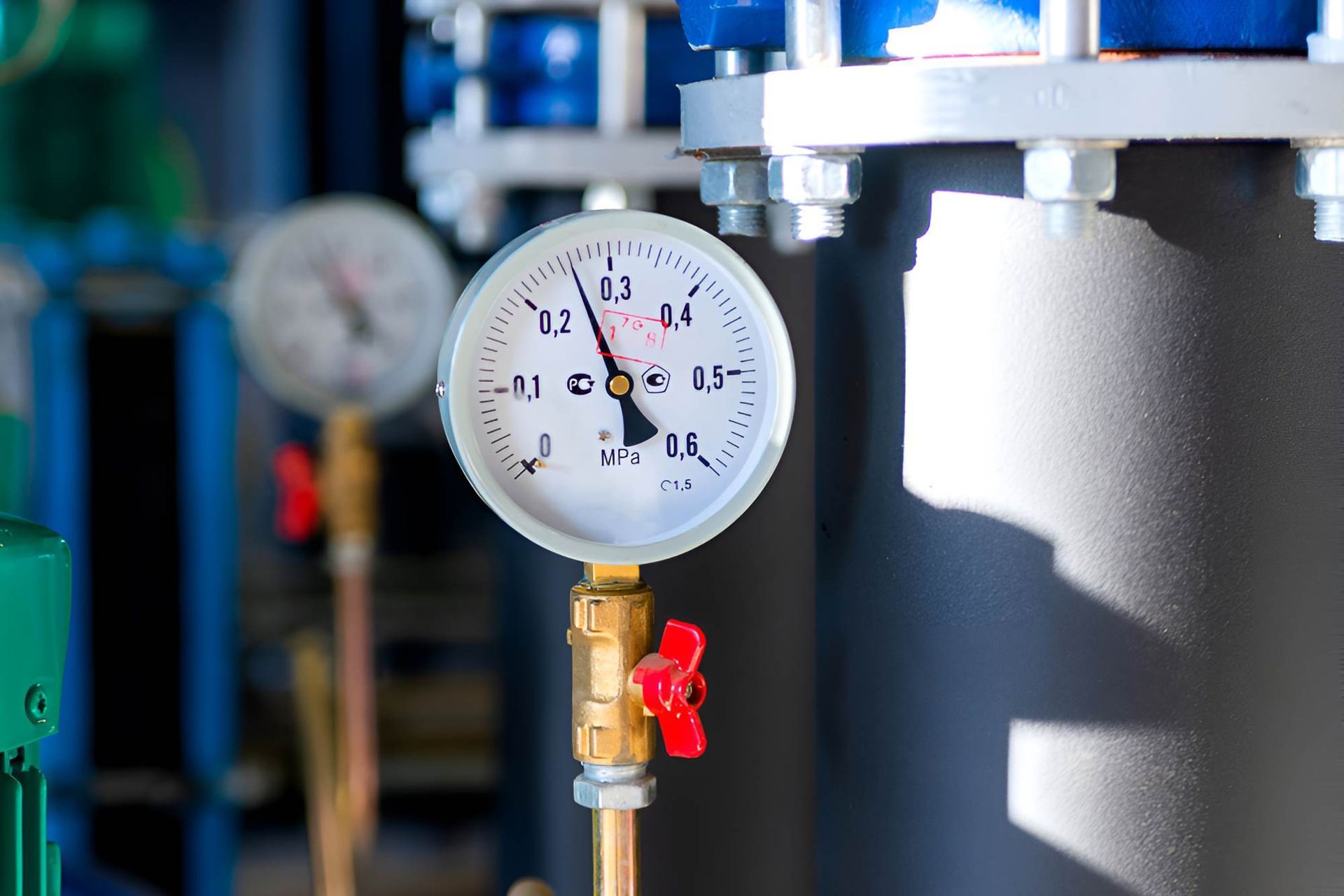 A Close Up Of A Pressure Gauge On A Pipe In A Factory — Christians Plumbing in Emerald, QLD