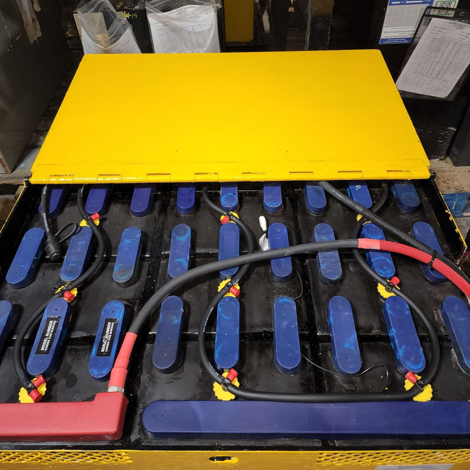 A bunch of batteries are sitting on top of each other on a table.