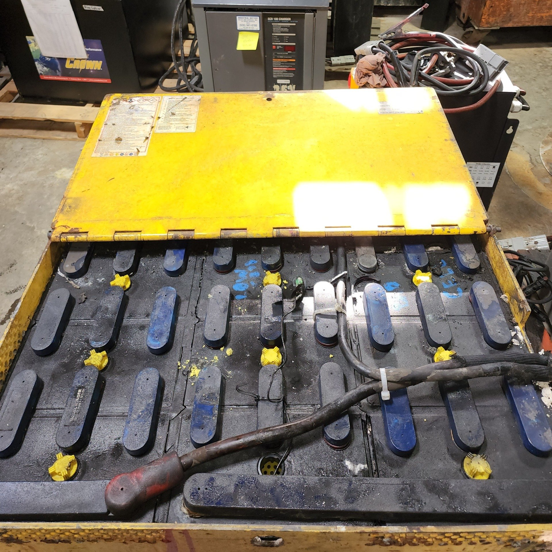 A bunch of batteries in a box with a yellow top