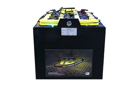 A black and yellow battery is sitting on top of a white surface.