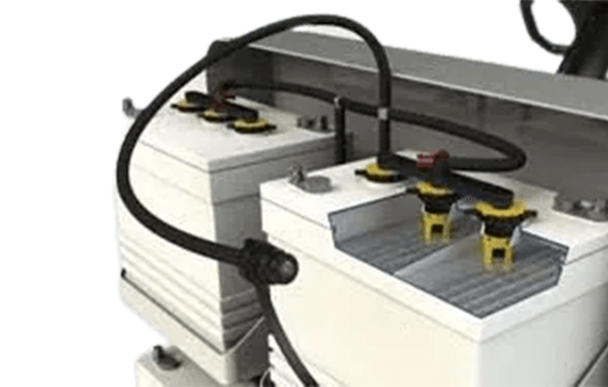 A close up of a battery with a hose attached to it