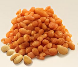 A pile of peanuts on a white surface