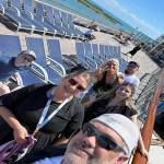 A group of people are taking a selfie on a cruise ship.