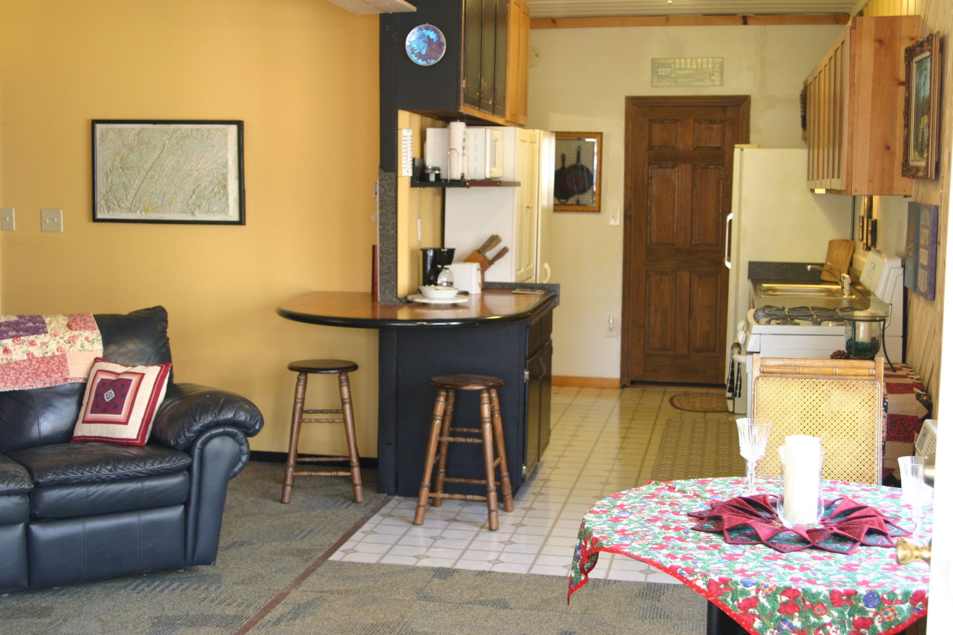A living room with a couch a chair and a table