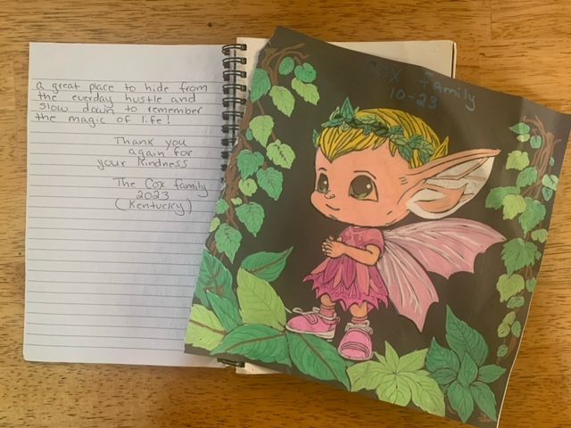 A notebook with a picture of a fairy on it