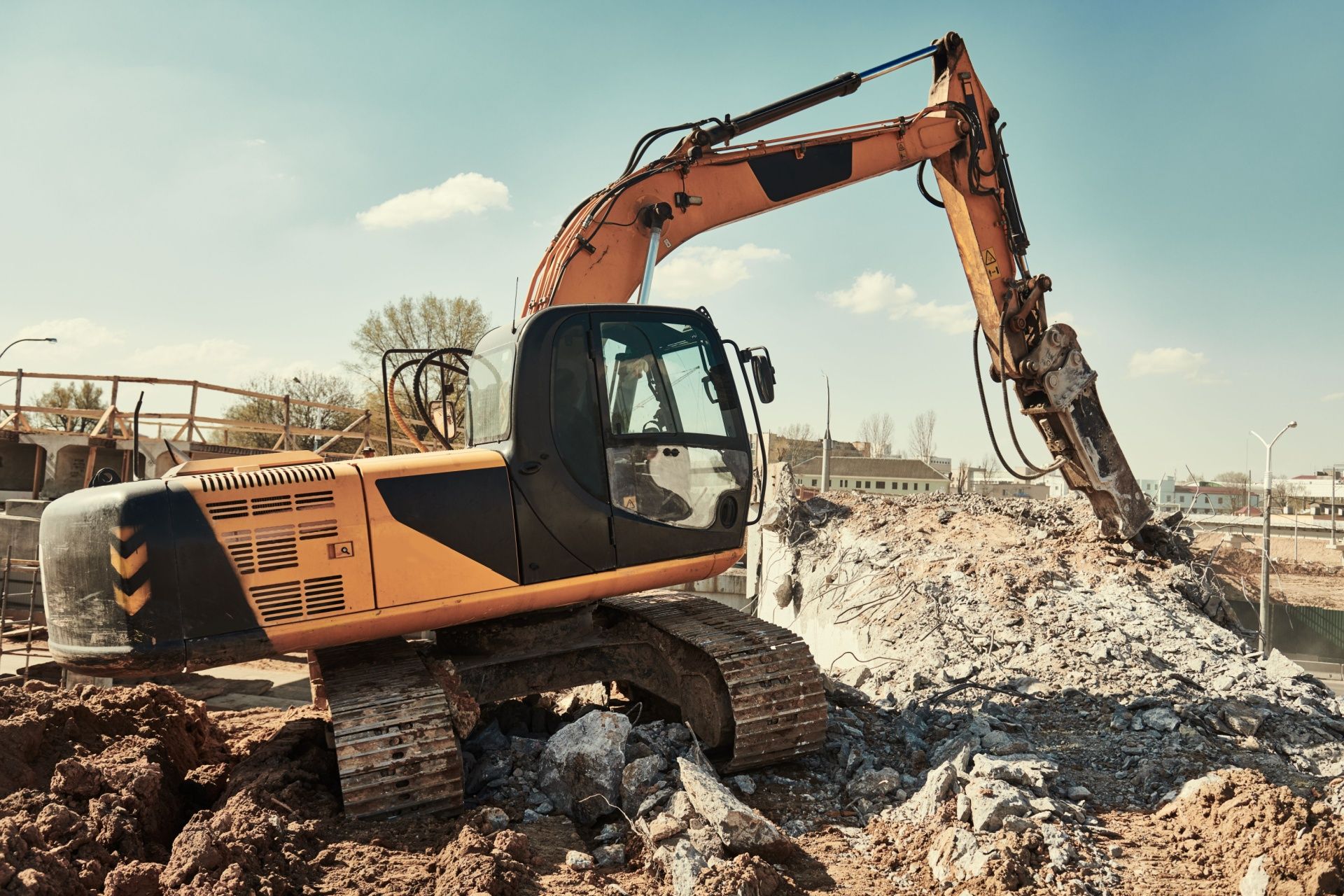 A large excavator is working on a construction site.