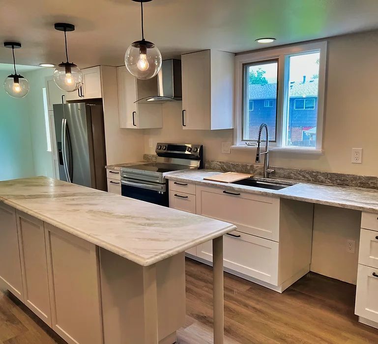 There is a large island in the middle of the kitchen.