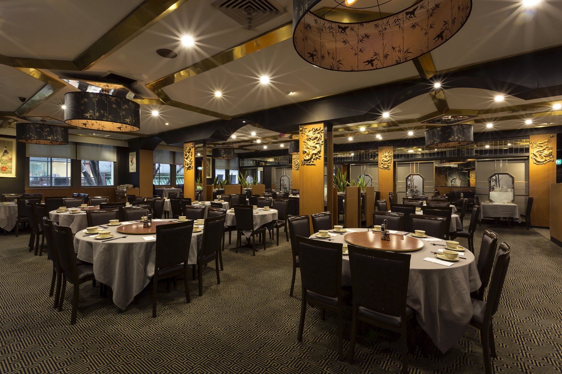 A large dining room filled with tables and chairs.