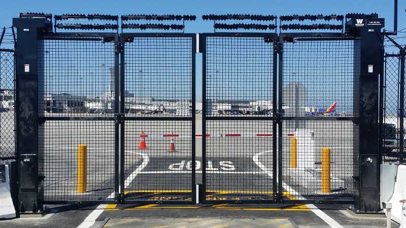 Commercial bi-fold or double driveway security gate