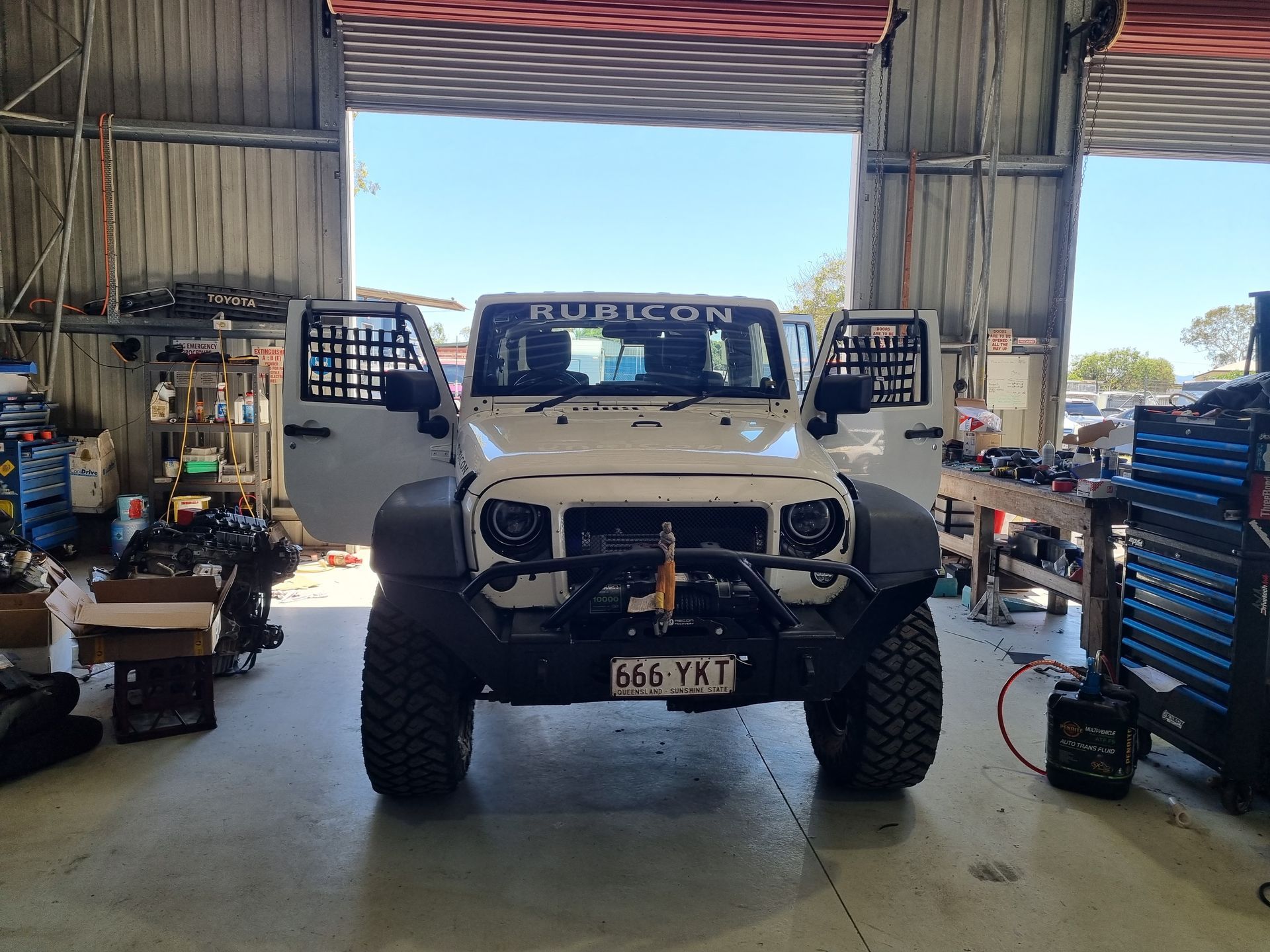 White Toyota Van With a Bull Bar, Parked Inside a Garage — Track N Back 4x4 In Mareeba, QLD