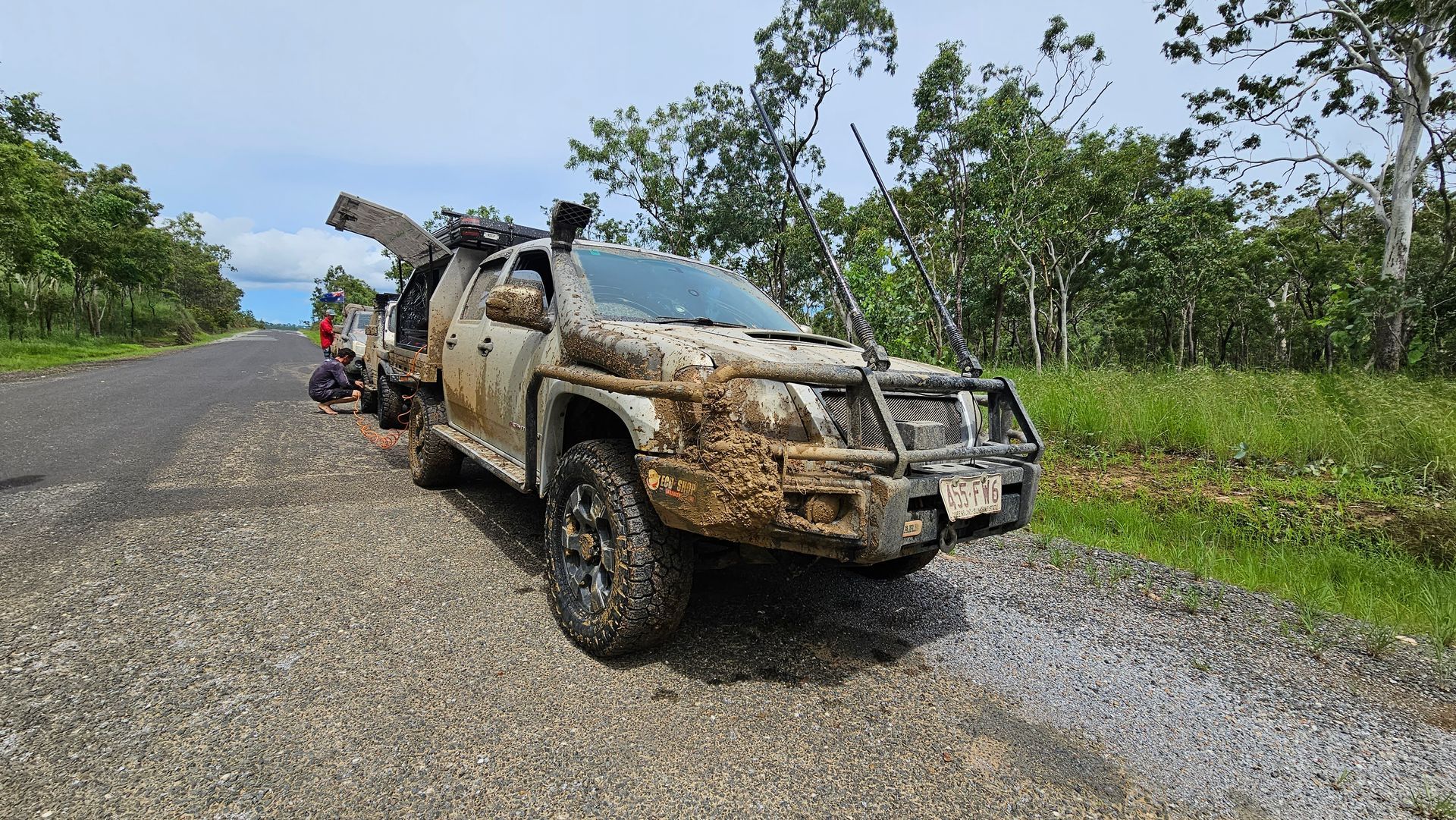 Black pickup truck with a custom cargo area and attached trailer parked outside — Track N Back 4x4 In Mareeba, QLD