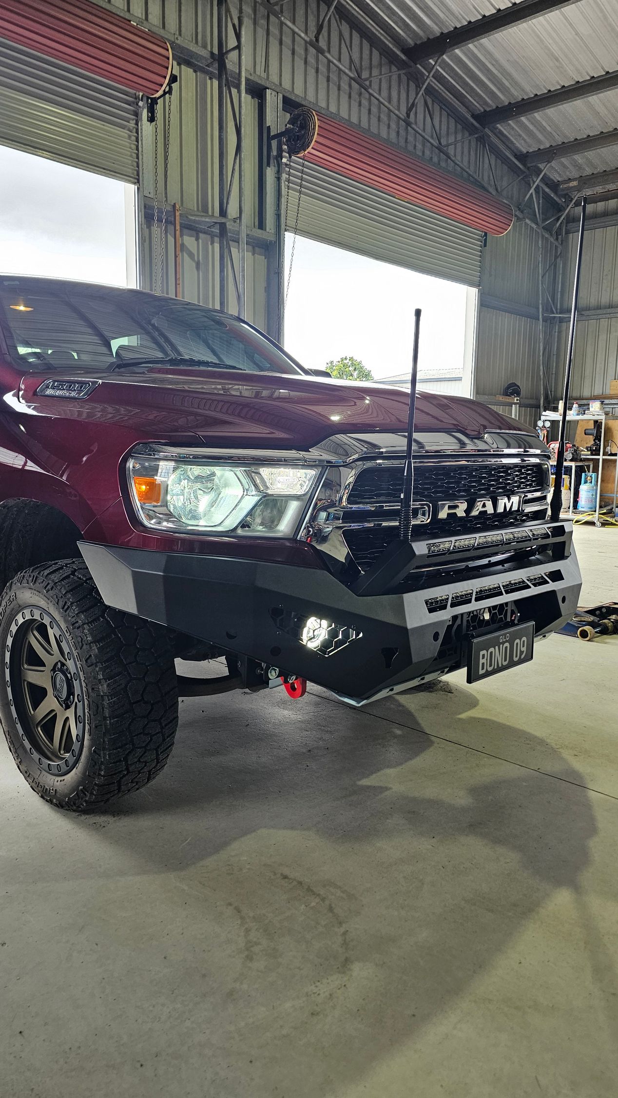 Burgundy Toyota Land Cruiser with black bumper in a garage — Track N Back 4x4 In Mareeba, QLD