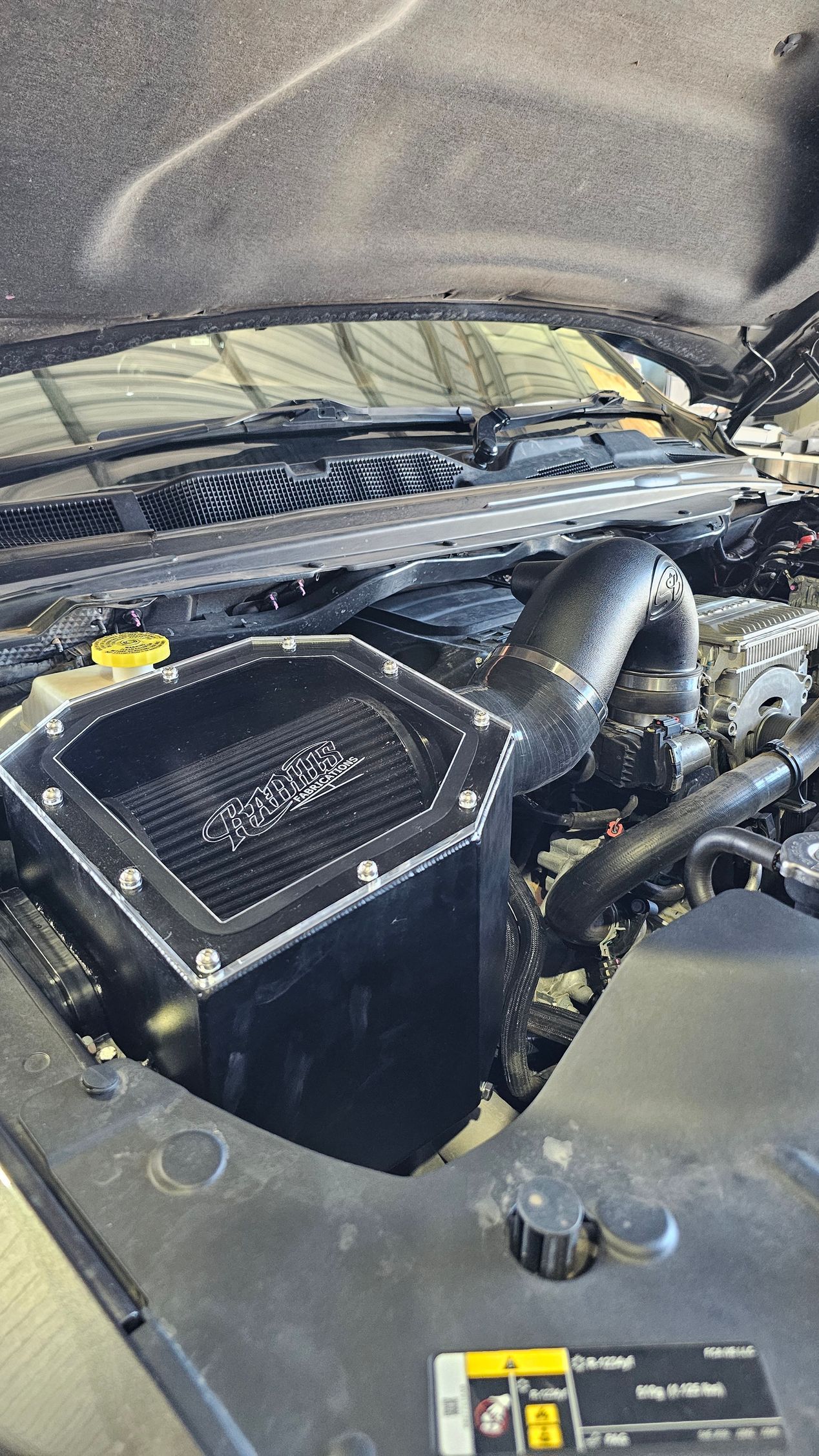 Open car hood, showcasing a black aftermarket cold air intake system — Track N Back 4x4 In Mareeba, QLD