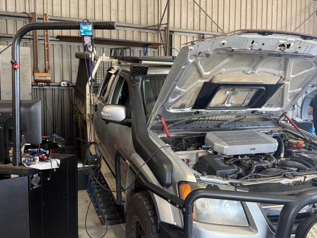 A Silver Truck With Its Hood Open, Likely Undergoing a Mechanic Checkup — Track N Back 4x4 In Normanton, QLD