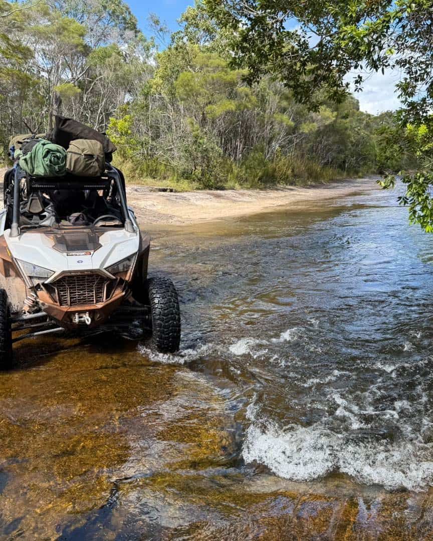 Off-road Vehicle Fording a Shallow River, Passing Over a Sandy — Track N Back 4x4 In Port Douglas, QLD