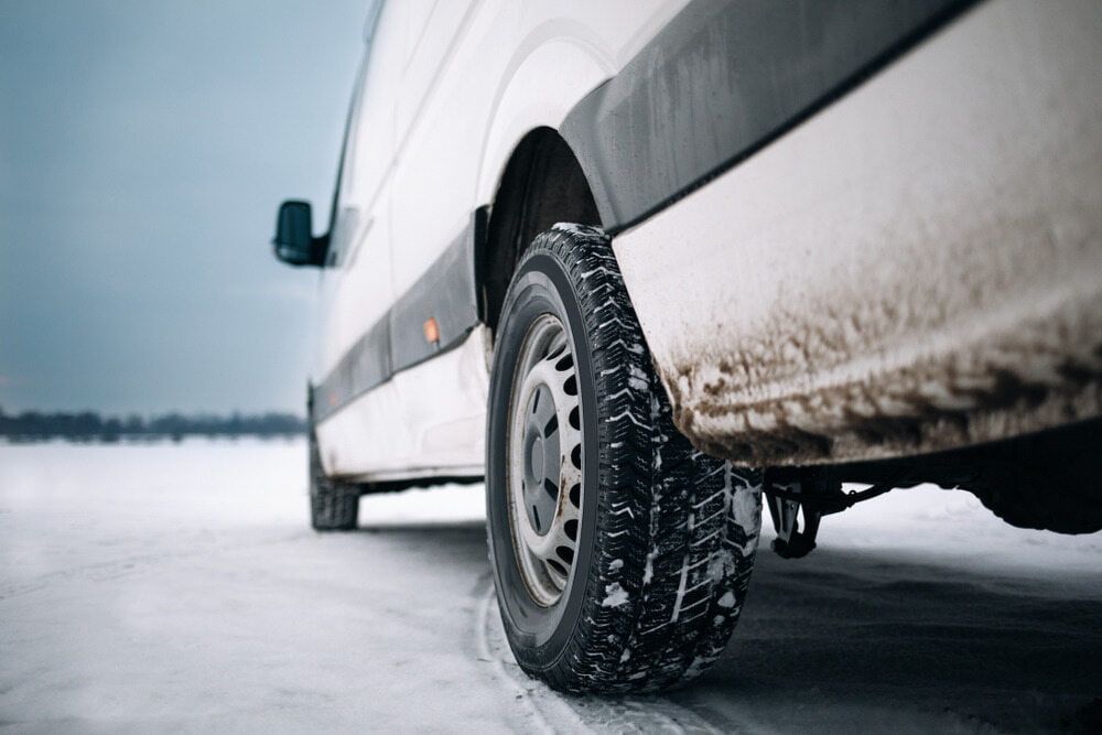 White Van With Winter Tires on Snowy Road — Track N Back 4x4 In Bamaga, QLD