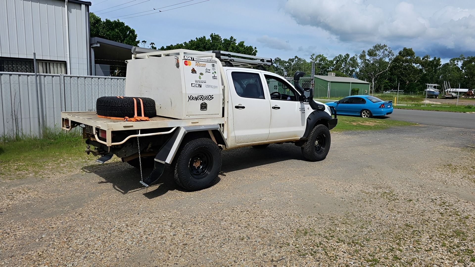 Mechanic With Wrench, Repairing a White Car's Engine in a Garage — Track N Back 4x4 In Atherton, QLD