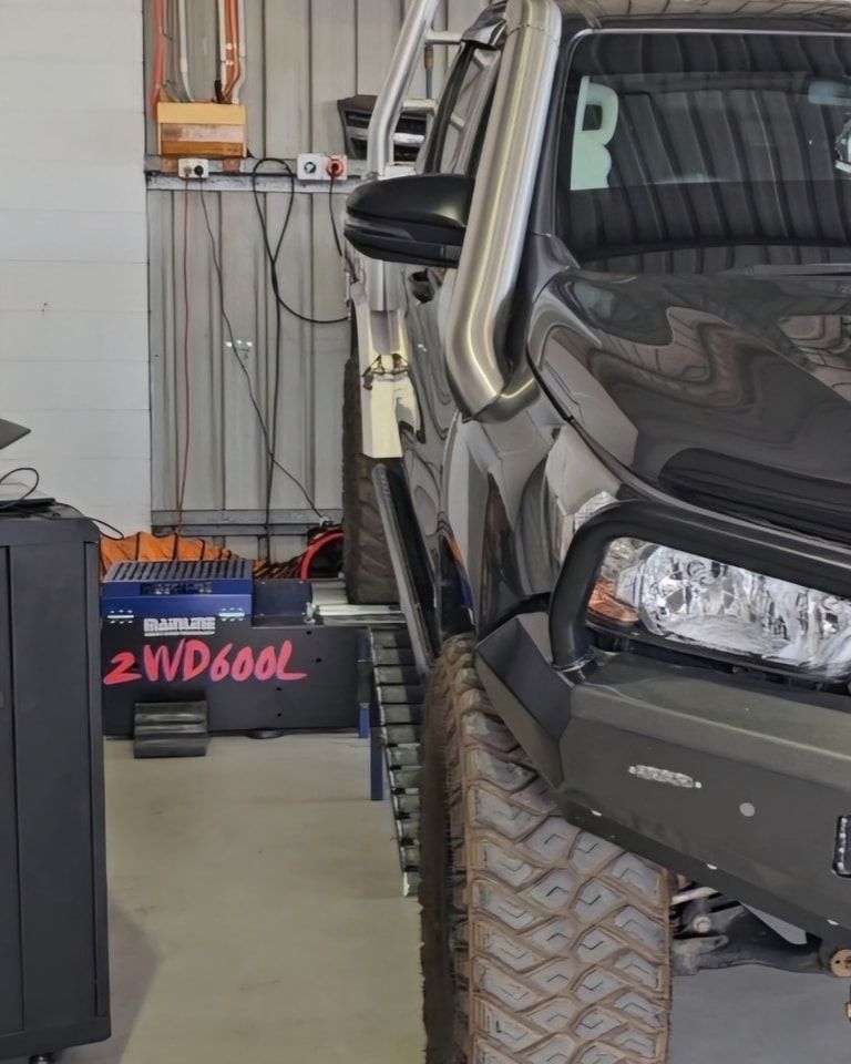 Red Jumper Cables Connected to a Car Battery With the Hood Open — Track N Back 4x4 In Atherton, QLD