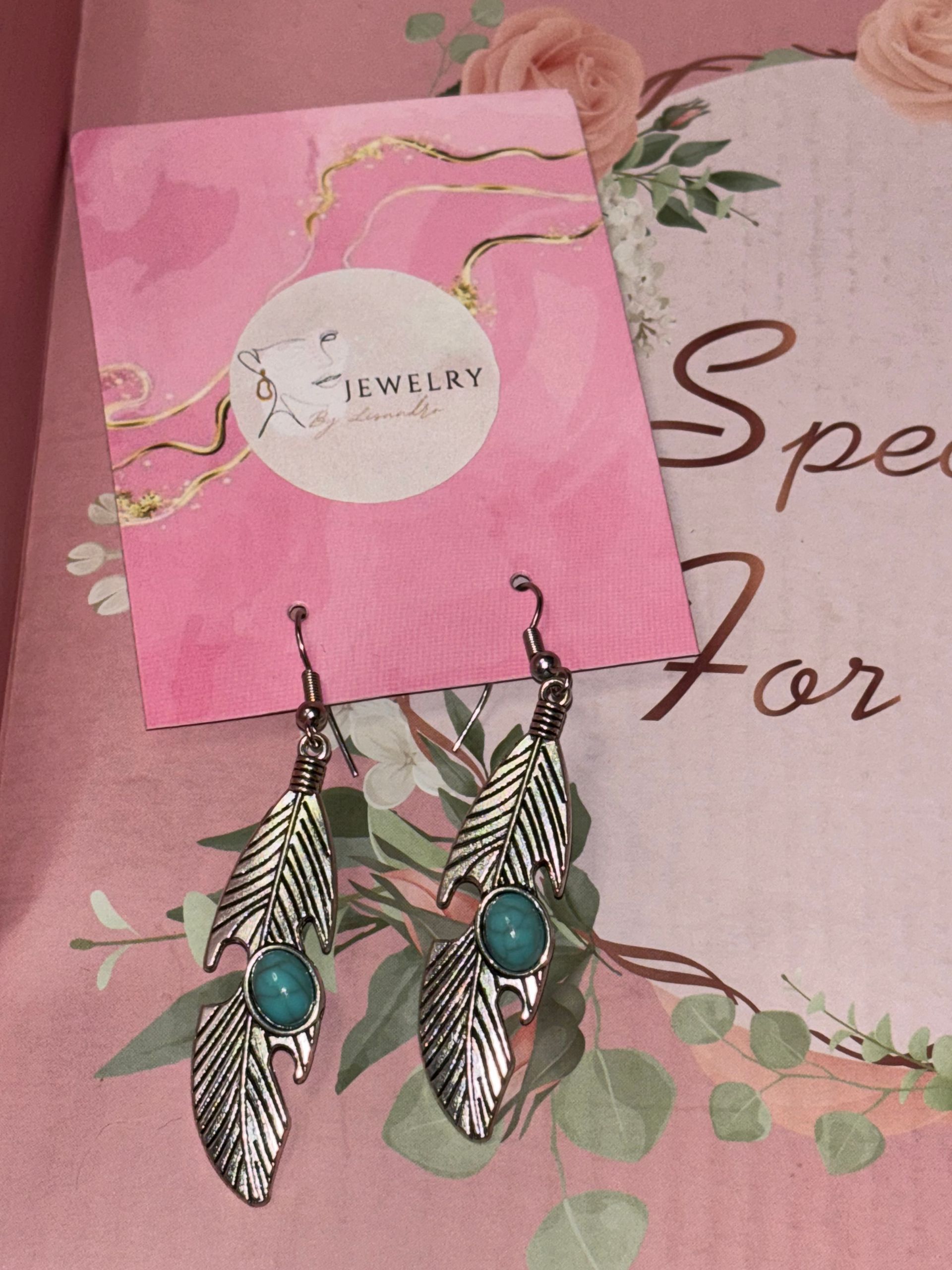 Een zilver blaadje met een steen oase