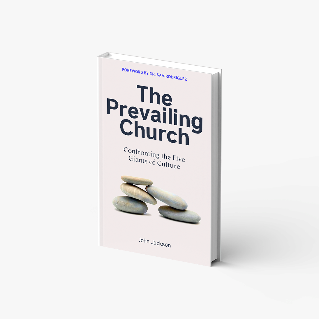 A book titled the prevailing church is sitting on a white surface.