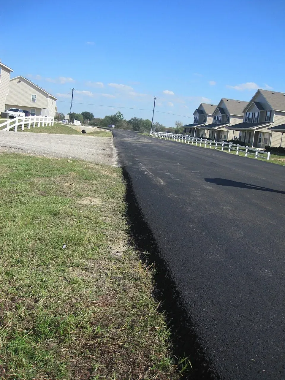 A row of houses on the side of a road