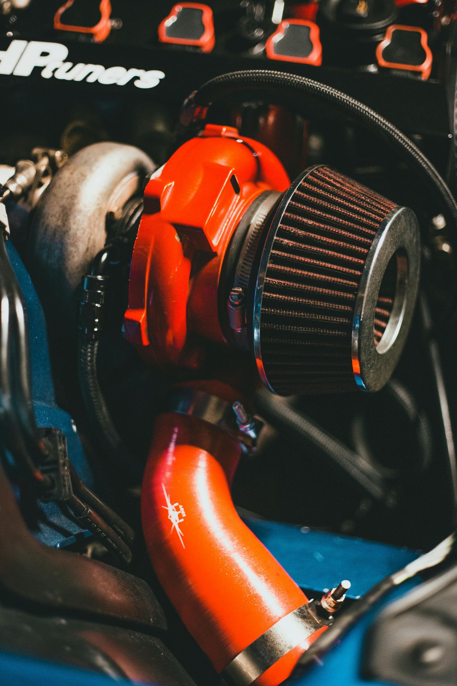 Custom turbocharger hose in a maroon engine bay.