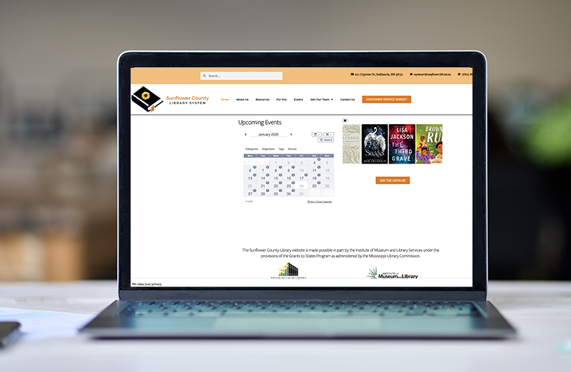 A laptop computer is sitting on top of a white table.