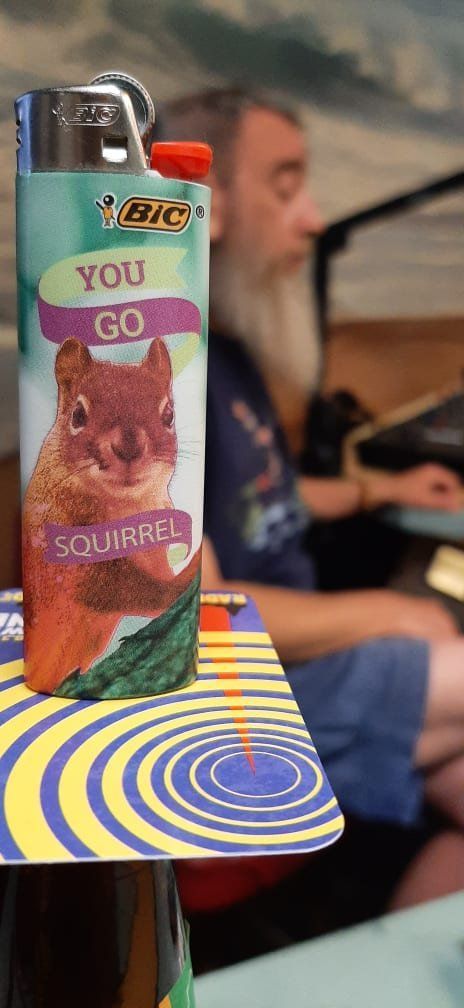 A bic lighter with a picture of a squirrel on it