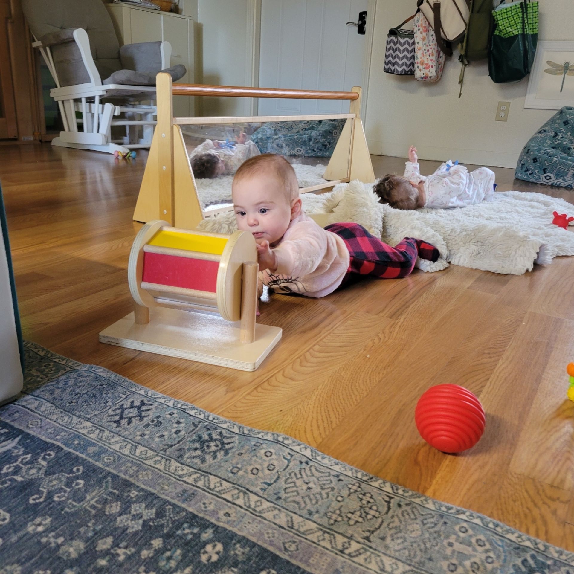Montessori infant  playing with on the floor.